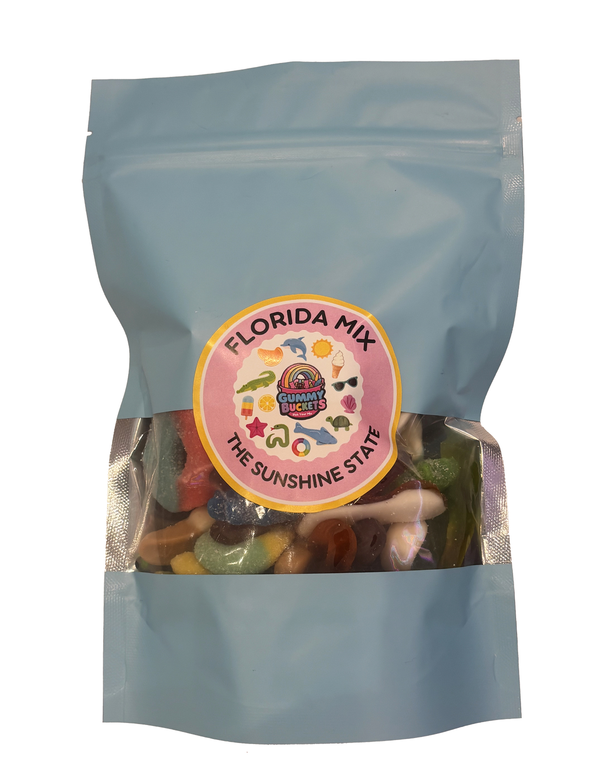 A light blue resealable stand-up pouch with a clear window showing a colorful assortment of Florida-themed gummy candies including sharks, alligators, starfish, and tropical shapes inside. A round pink and yellow label on the front reads 'FLORIDA MIX' and 'THE SUNSHINE STATE' with the Gummy Buckets logo surrounded by illustrated Florida icons in the center.