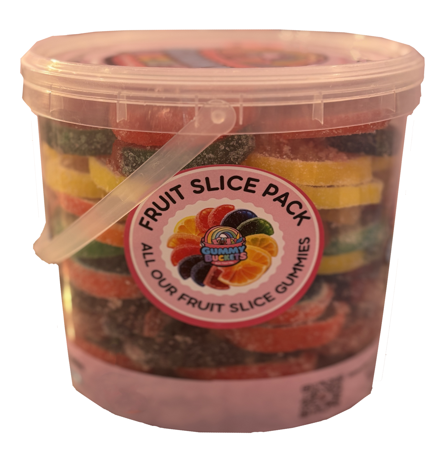 A clear plastic bucket filled with assorted fruit slice gummies, featuring a white lid with a clear plastic handle and a circular 'Fruit Slice Pack' label on the front. The gummies show colorful layers of different fruit slices.