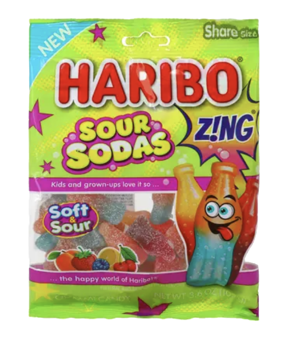 Green HARIBO Sour Sodas bag with colorful bottle-shaped gummies visible through its window.