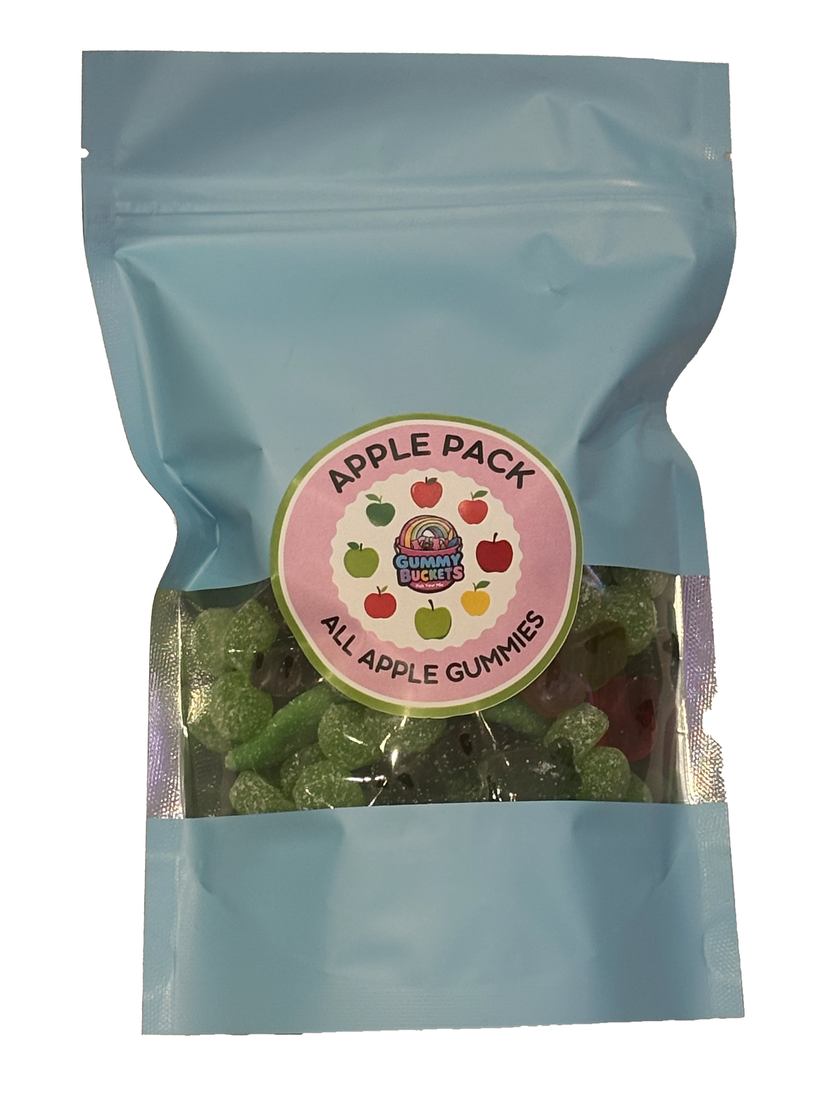 A light blue resealable stand-up pouch with a clear window showing green and red apple-shaped gummy candies inside. A round pink label on the front reads 'APPLE PACK' and 'ALL APPLE GUMMIES' with the Gummy Buckets logo surrounded by illustrated apple icons in the center.
