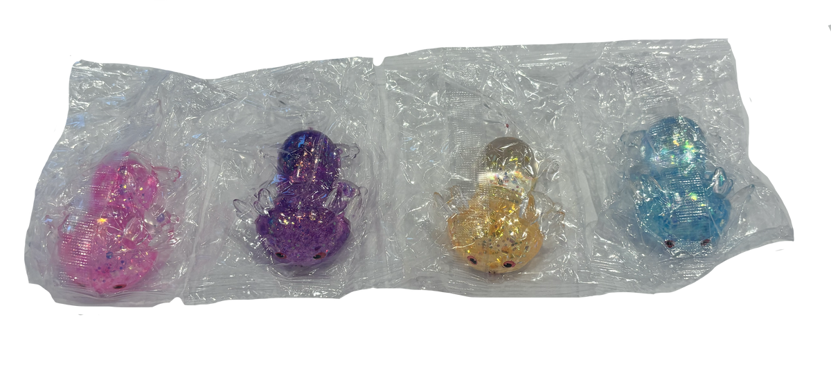 Four small glittery toy figures in clear plastic packaging, shown in pink, purple, orange, and blue on a white background.