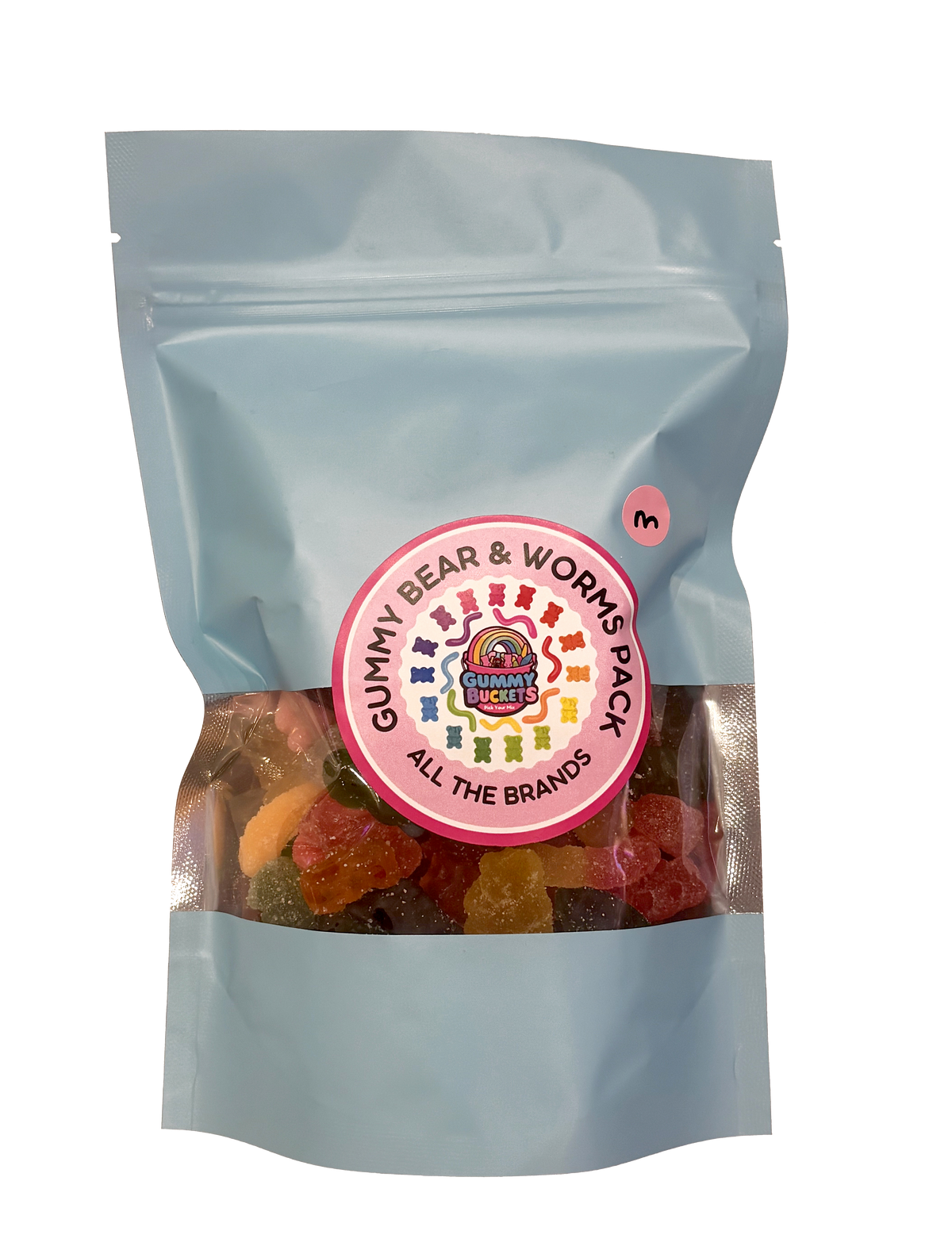 A light blue stand-up resealable pouch of gummy bear and works pack gummy candies, with a circular pink and white brand label in the center and a small pink number 3 sticker near the top right.
