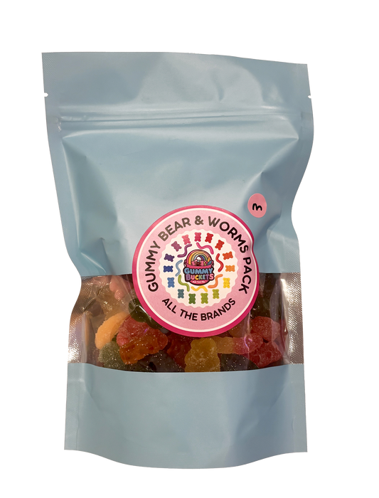 A light blue stand-up resealable pouch of gummy bear and works pack gummy candies, with a circular pink and white brand label in the center and a small pink number 3 sticker near the top right.