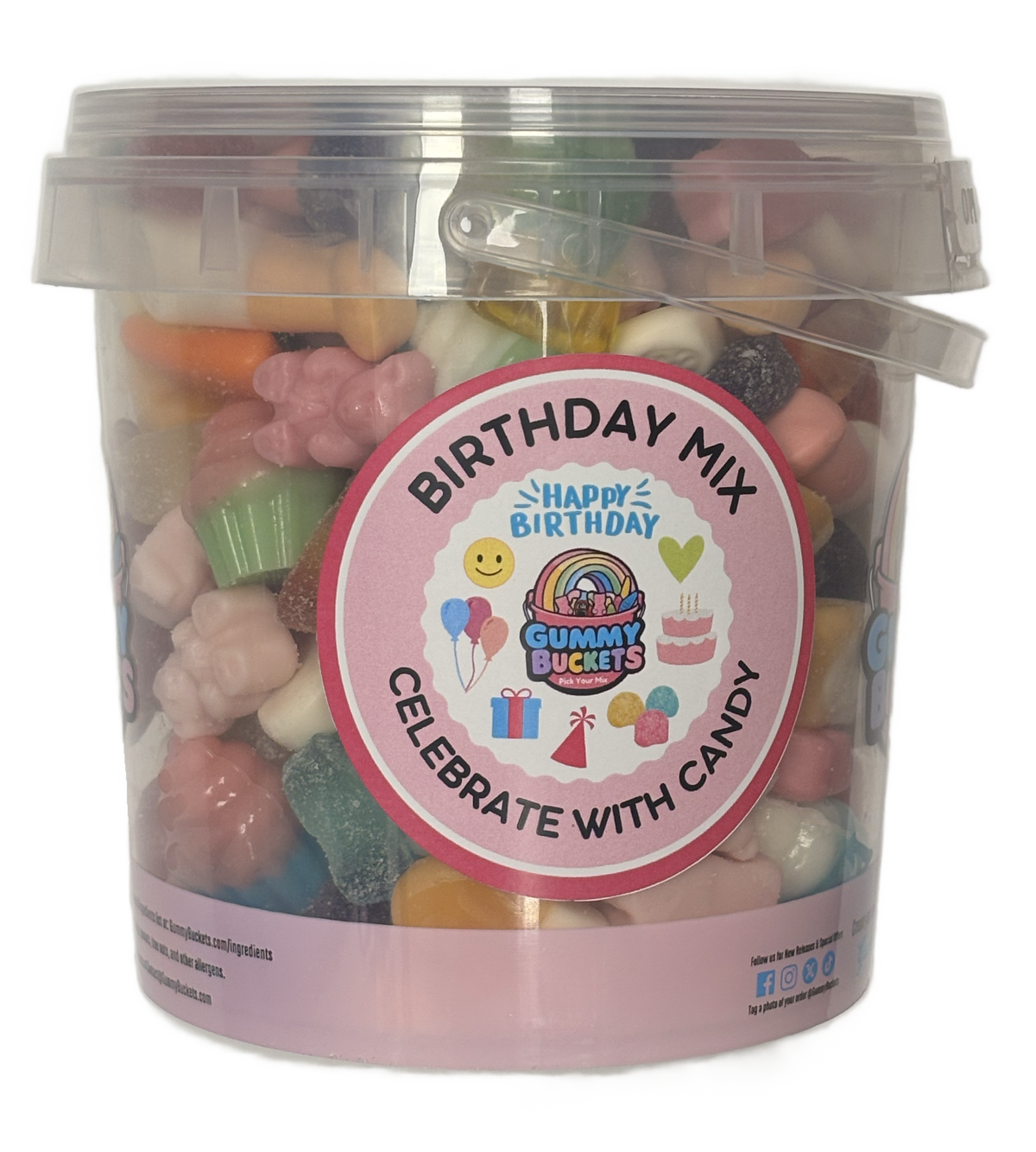 A clear plastic bucket filled with assorted colorful gummy candies, featuring a round pink label that reads 'BIRTHDAY MIX' and 'CELEBRATE WITH CANDY' with 'Happy Birthday' written in the center.