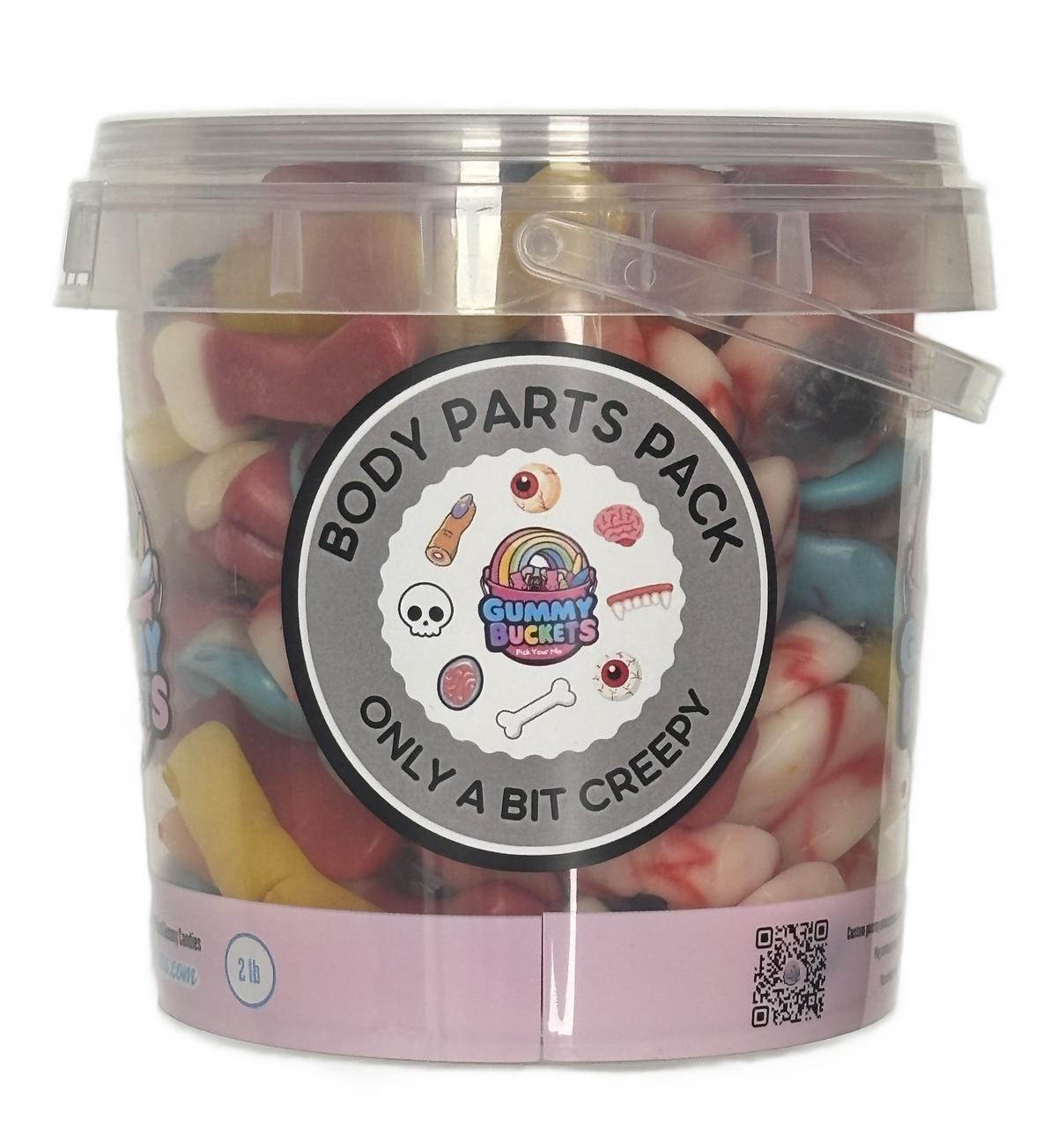 A clear plastic bucket filled with assorted gummy candies, featuring a round label that reads 'BODY PARTS PACK' and 'ONLY A BIT CREEPY' with cartoon body-part illustrations. The bucket is photographed on a plain white background.