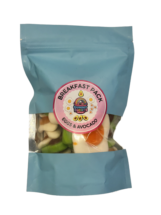 A light blue stand-up pouch of 'Breakfast Pack Eggs & Avocado' by Chumney Creek, containing mixed avocado toast pieces visible through a clear window, with a pink circular label on the front.