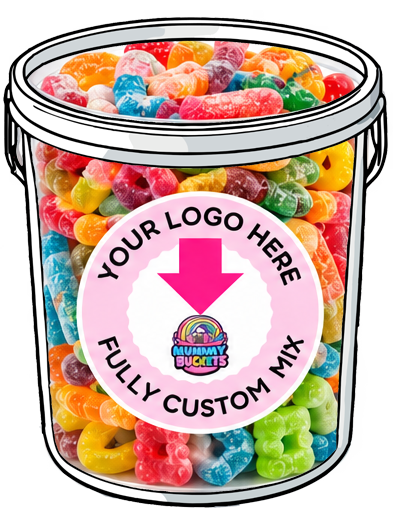 A clear plastic bucket filled with colorful gummy candies, shown on a white background with a large pink circular label that reads 'YOUR LOGO HERE' and 'FULLY CUSTOM MIX' with a rainbow logo for Gummi Buckets.