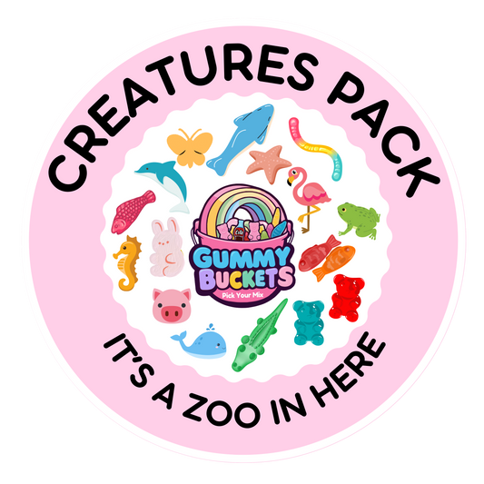 A round promotional sticker or label for a 'Creatures Pack' featuring a pink border and white center. The center shows the 'Gummy Buckets London' logo surrounded by colorful cartoon animal illustrations, including a dolphin, flamingo, frog, crocodile, turtle, rabbit, and gummy bear.