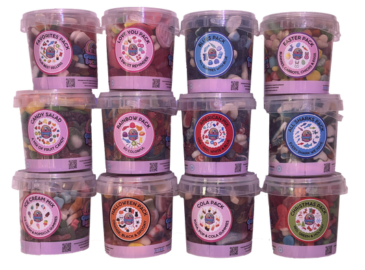 Twelve Gummy Buckets Candy Club buckets with assorted gummy mixes and seasonal labels, arranged in three rows of four.