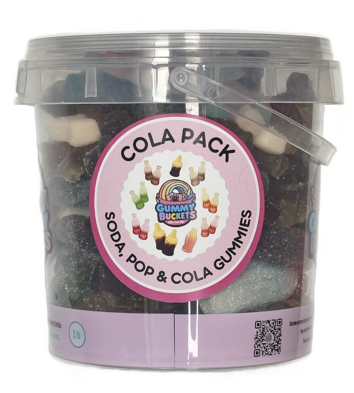 A clear plastic bucket filled with assorted gummy candies, featuring a pink circular label that reads 'COLA PACK' and 'SODA, POP & COLA GUMMIES,' with 'Gummy Buckets' branding in the center.