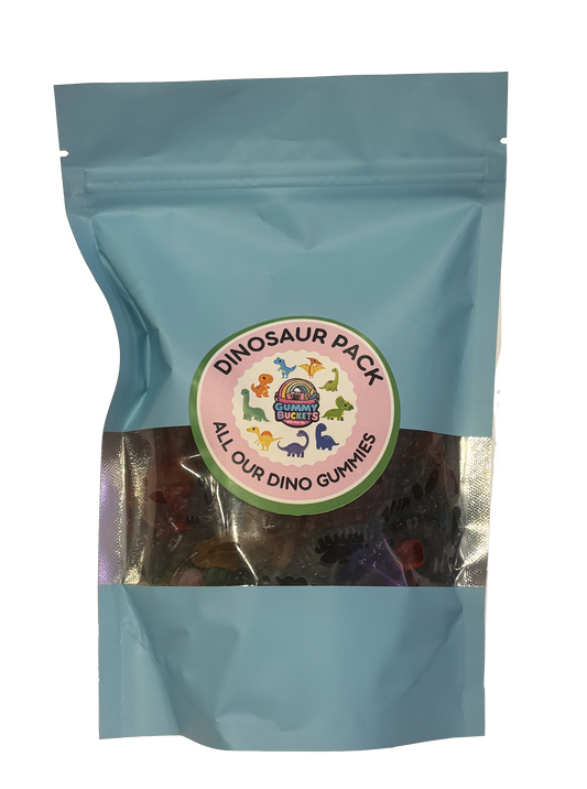 A light blue resealable stand-up pouch containing a dinosaur-themed gummy candy mix. A circular label on the front reads 'DINOSAUR PACK' and 'ALL OUR DINO GUMMIES,' with colorful dinosaur illustrations and the brand name 'Dino Gummy Bites.