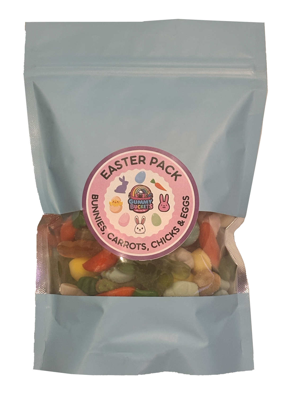 A light blue stand-up pouch of Easter treats with a clear window showing mixed candy pieces inside. A round pink label on the front reads 'EASTER PACK' and 'BUNNIES, CARROTS, CHICKS & EGGS' with bunny and rainbow illustrations.