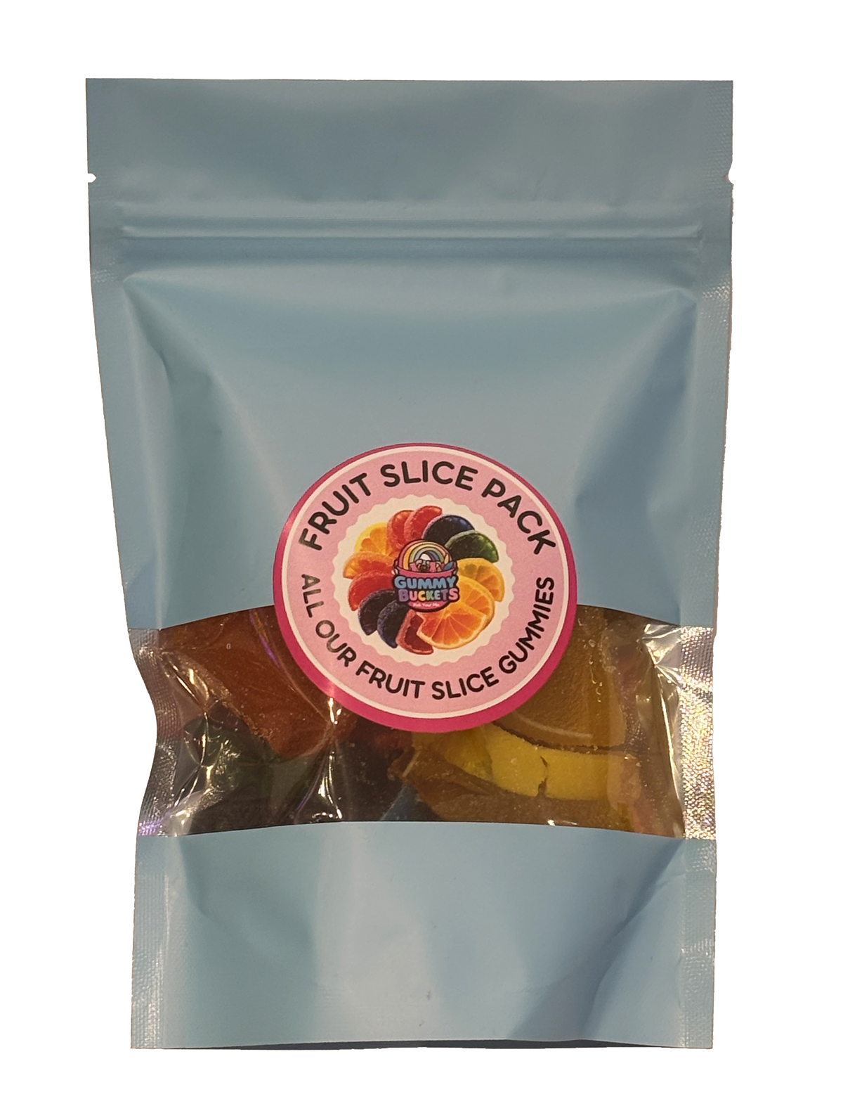 A light blue resealable stand-up pouch with a clear window showing large fruit slice gummy candies in orange, red, yellow, and black inside. A round pink label on the front reads 'FRUIT SLICE PACK' and 'ALL OUR FRUIT SLICE GUMMIES' with the Gummy Buckets logo surrounded by illustrated fruit slice candy icons in the center.
