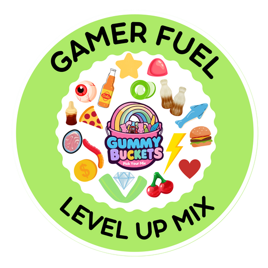 A circular product graphic for Gummy BUCKETS 'All Levels' gummy candy mix, titled 'GAMER FUEL LEVEL UP MIX'. The design features a light green outer ring with black text, a white inner circle, and a colorful assortment of gaming and retro-themed gummies illustrated around the center logo.