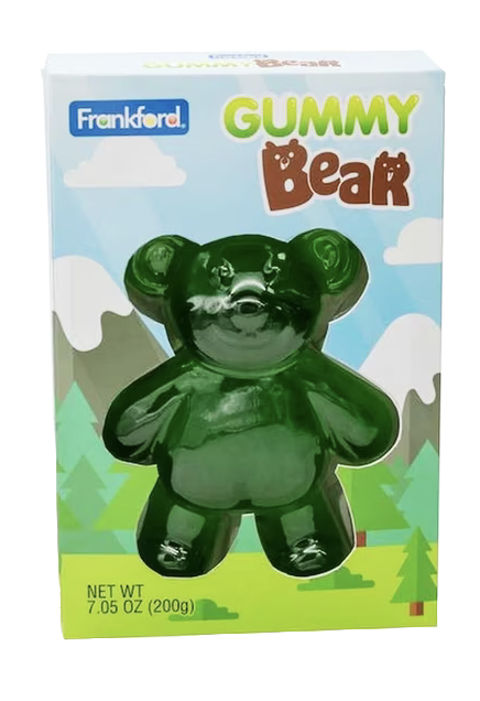 Frankford Gummy Bear candy in its original retail packaging. The box features a clear window displaying a glossy, dark green gummy bear against a whimsical background of blue sky, clouds, and green trees.
