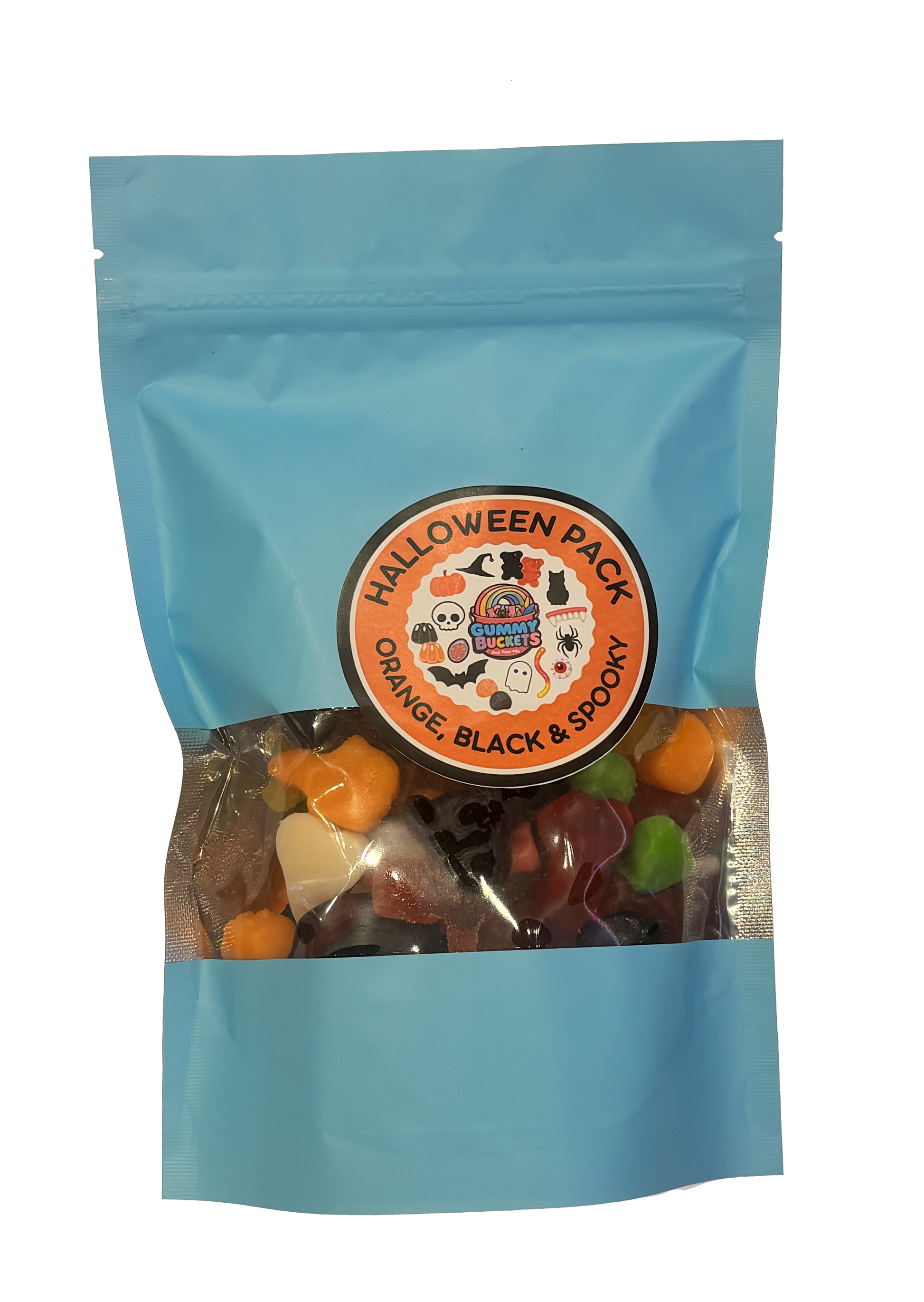 A light blue stand-up pouch of Halloween gummy candy mix with a clear window showing orange, black, and green gummies inside. The front has a circular orange label reading 'HALLOWEEN PACK ORANGE, BLACK & SPOOKY' with a cartoon witch logo.