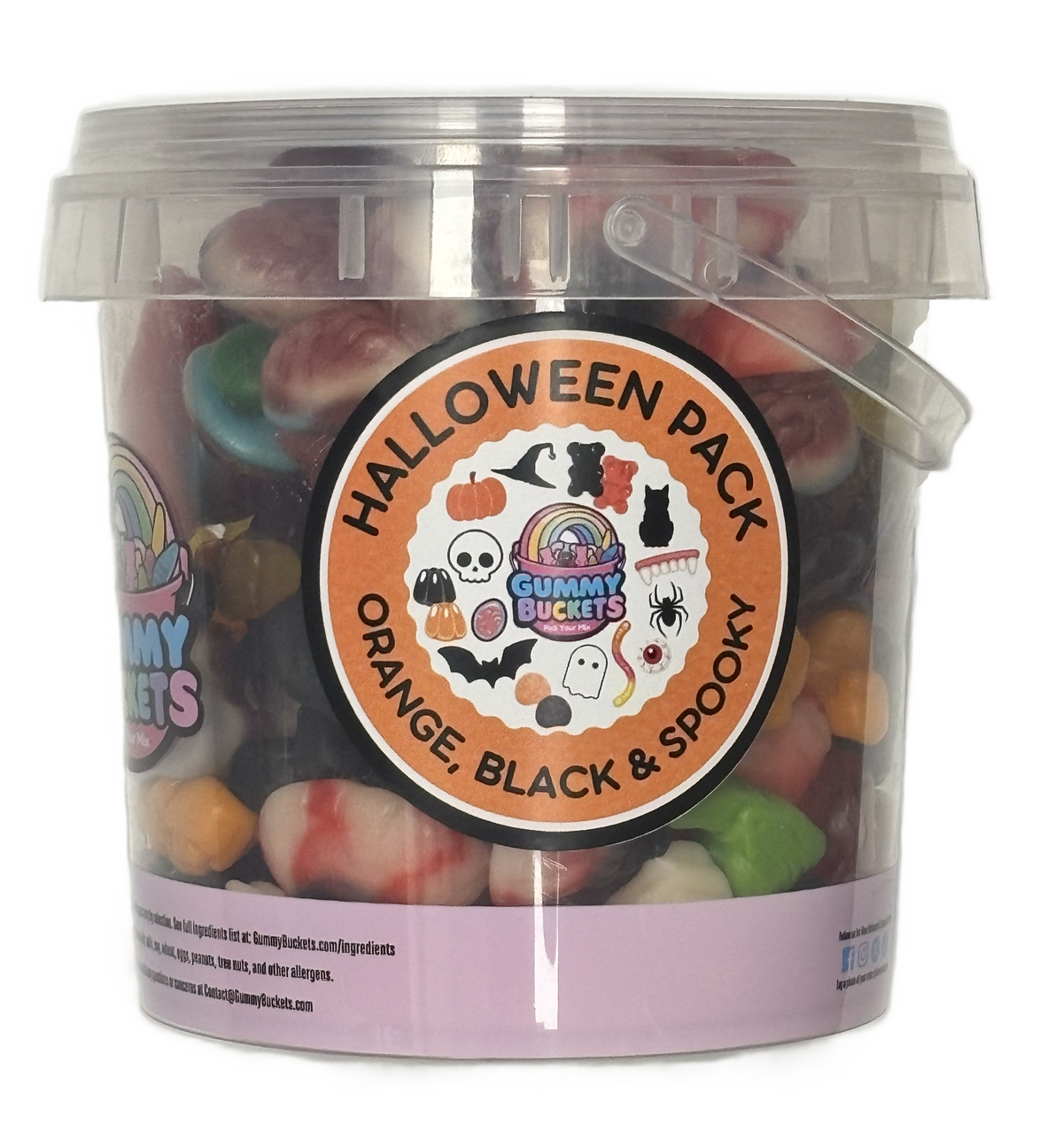 A clear plastic tub of Gummy Buckets Halloween Pack gummy candies, showing a mix of orange, black, and spooktacularly colored gummies inside. The tub features a large circular orange and black label with illustrations of pumpkins, bats, ghosts, and a rainbow, and a light purple band at the bottom.