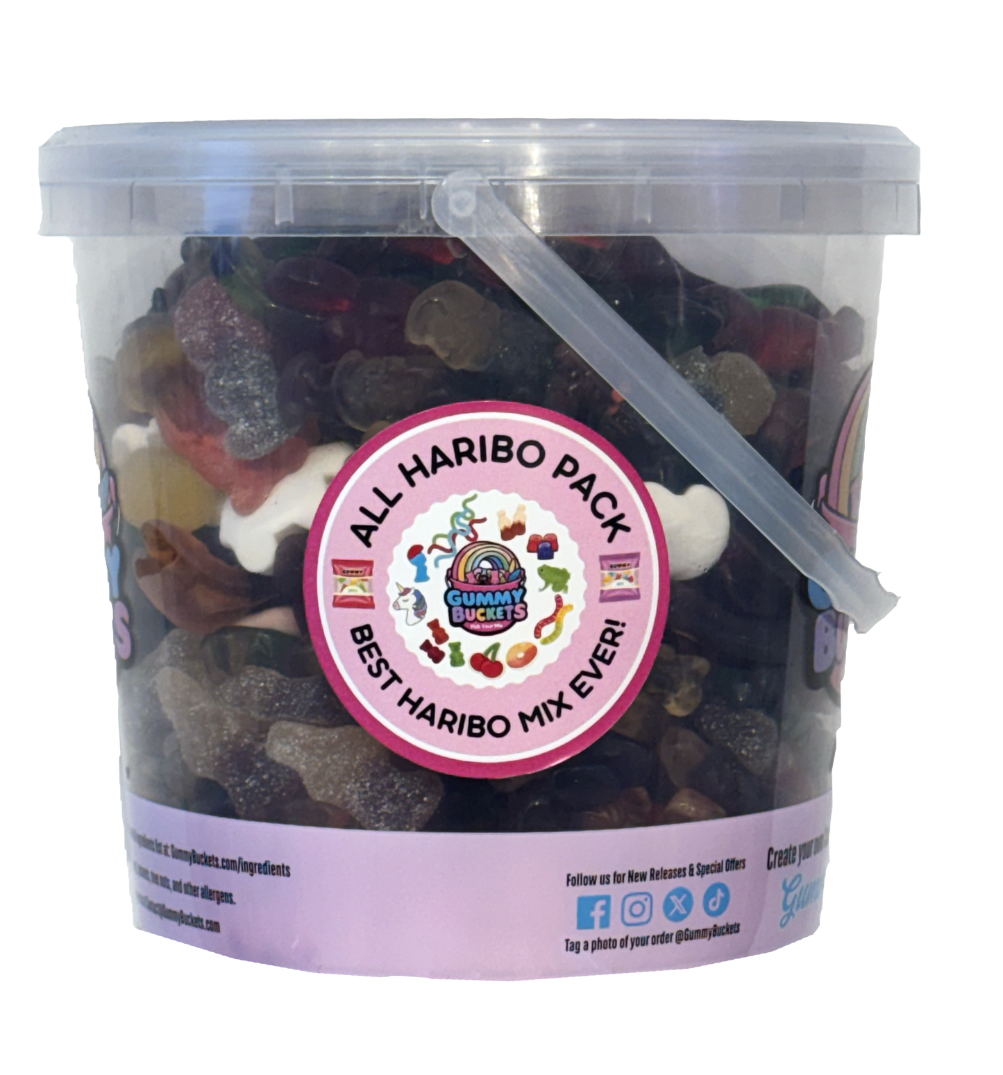 A clear plastic bucket filled with assorted gummy candies, featuring a large round sticker on the front that reads 'ALL HARIBO PACK' and 'BEST HARIBO MIX EVER!'. The bucket has a translucent lid with a clear plastic handle, and the bottom rim has a light purple band with social media details.