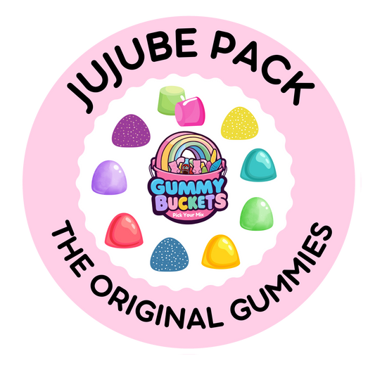 A circular pink label or packaging graphic for a 'Jujube Pack' by Gummy Bucketz. The design features a light pink background with a scalloped white inner border, bold black text reading 'JUJUBE PACK' at the top and 'THE ORIGINAL GUMMIES' at the bottom, and an illustration of colorful jelly beans surrounding the brand logo.