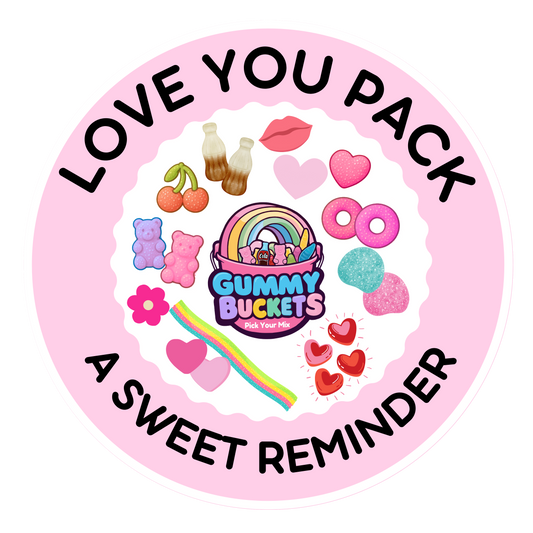A circular pink sticker or label with the text 'LOVE YOU PACK' and 'A SWEET REMINDER' surrounding a colorful central design. The center features the brand name 'Gummy Buckets Party Pouch' with a rainbow bucket, surrounded by candy-themed illustrations including cherries, gummy bears, donuts, hearts, and a rainbow.