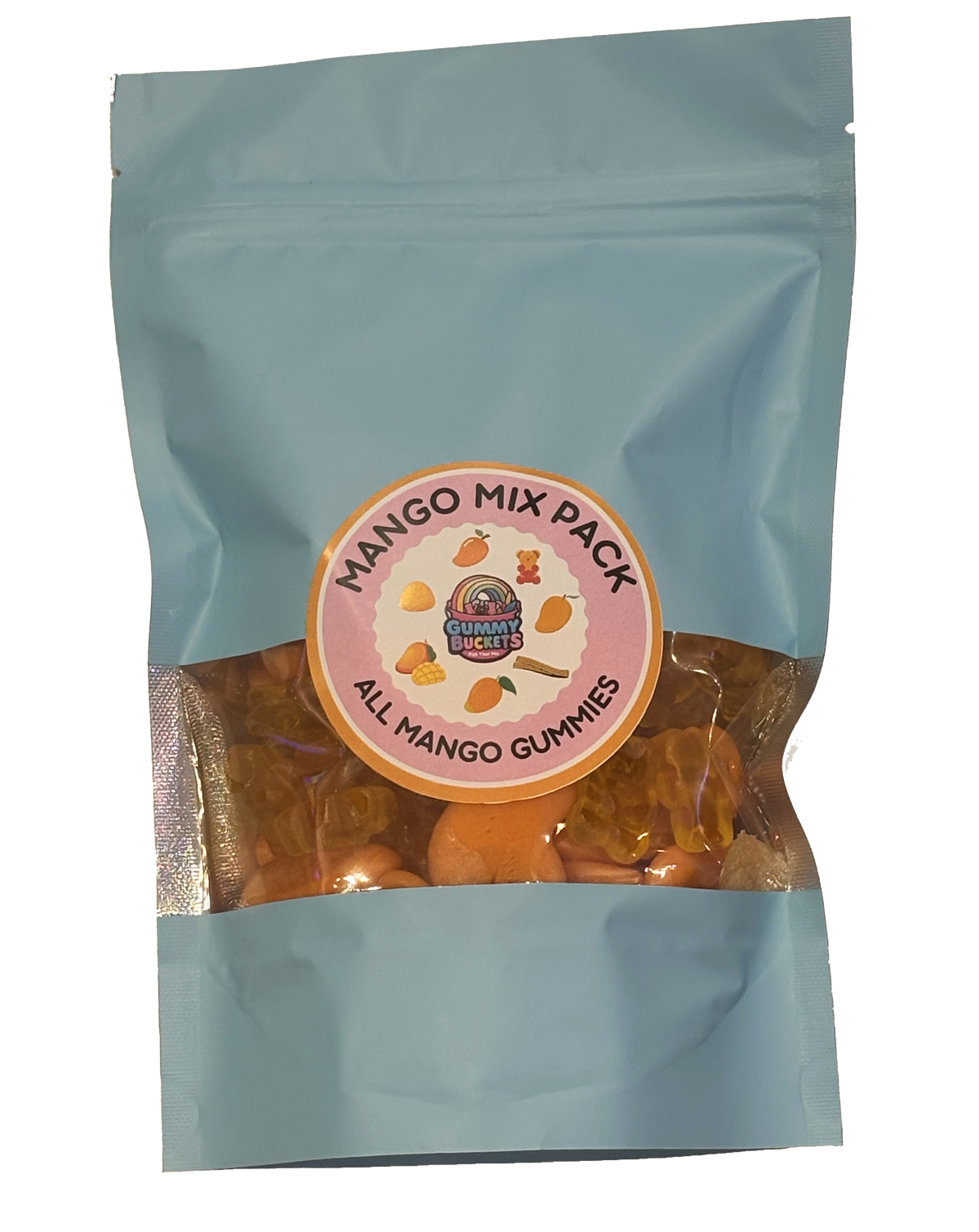 A light blue resealable stand-up pouch with a clear window showing golden orange mango-flavored gummy candies including bears and rings inside. A round pink and orange label on the front reads 'MANGO MIX PACK' and 'ALL MANGO GUMMIES' with the Gummy Buckets logo surrounded by illustrated mango icons in the center.