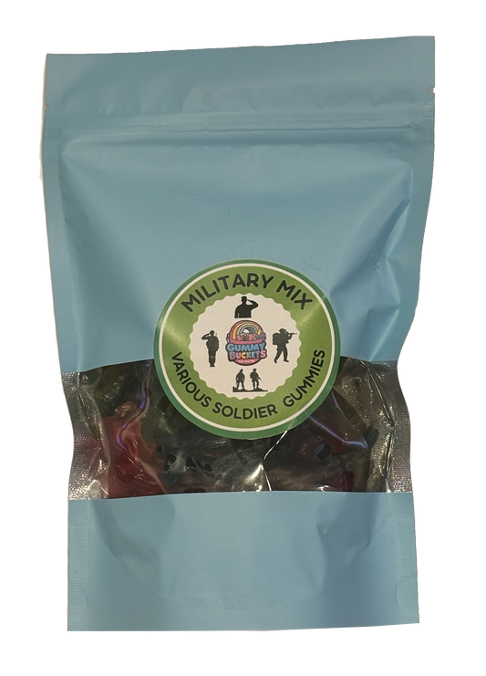 A light blue resealable stand-up pouch with a clear window showing dark green and black military soldier-shaped gummy candies inside. A round green label on the front reads 'MILITARY MIX' and 'VARIOUS SOLDIER GUMMIES' with the Gummy Buckets logo flanked by illustrated soldier silhouettes in the center.