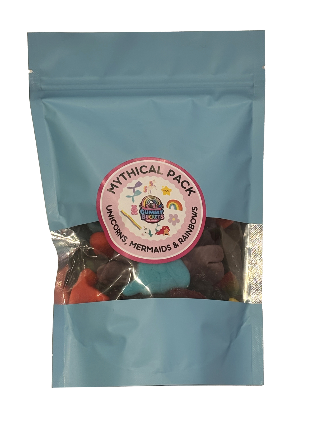 A light blue resealable stand-up pouch with a clear window showing a colorful assortment of mythical creature-shaped gummy candies including unicorns, mermaids, and rainbow shapes in blue, red, orange, and purple inside. A round pink label on the front reads 'MYTHICAL PACK' and 'UNICORNS, MERMAIDS & RAINBOWS' with the Gummy Buckets logo surrounded by illustrated mythical creature icons in the center.