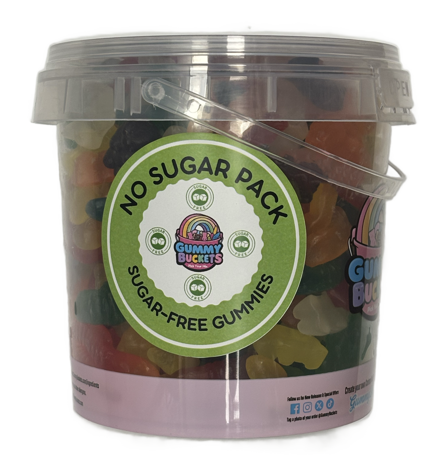 A clear plastic bucket filled with assorted gummy candies, featuring a large green circular label that reads 'NO SUGAR PACK SUGAR-FREE GUMMIES' with the Gummy Buckets logo. The bucket has a translucent lid and a clear plastic handle, set against a plain white background.