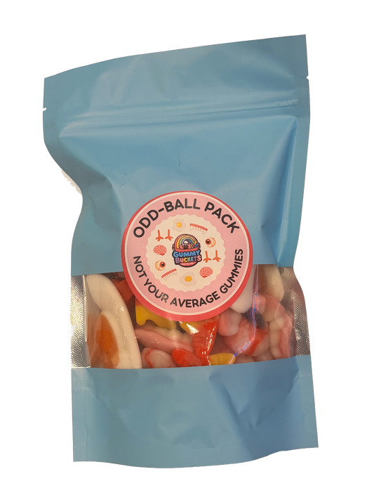 A light blue stand-up pouch of 'Odd Ball Pack' gummy candy, featuring a clear window that displays an assortment of colorful, irregularly shaped gummies. The pouch has a circular pink and white label in the center.
