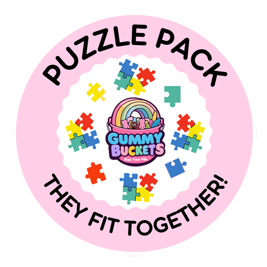 A circular pink graphic with the words 'PUZZLE PACK' at the top and 'THEY FIT TOGETHER!' at the bottom. The center shows a cartoon bucket labeled 'Gummy Buckets' surrounded by colorful puzzle-piece icons on a white scalloped background.