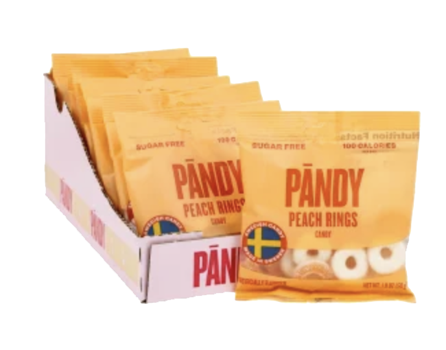 PANDY Peach Rings pouches in a display box with pale ring candies visible.