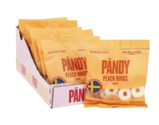 PANDY Peach Rings pouches in a display box with pale ring candies visible.
