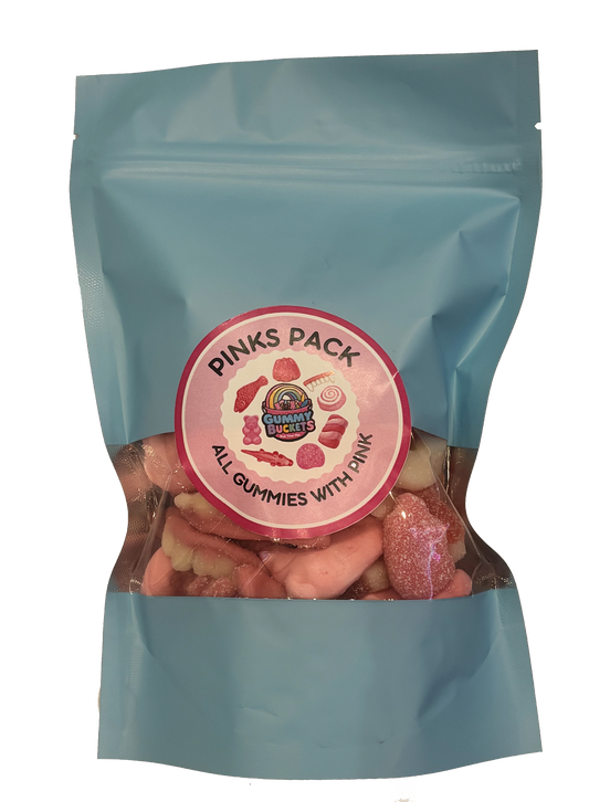 A light blue resealable stand-up pouch with a clear window showing a pink and white assortment of gummy candies including bears, worms, swirls, and fruit shapes inside. A round pink label on the front reads 'PINKS PACK' and 'ALL GUMMIES WITH PINK' with the Gummy Buckets logo surrounded by illustrated pink candy icons in the center.