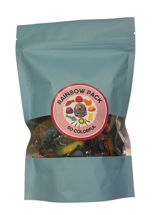 A light blue stand-up pouch of gummy candies with a clear window showing multicolored gummies inside. The front has a round pink label reading 'RAINBOW PACK' and 'SO COLORFUL' with candy illustrations.