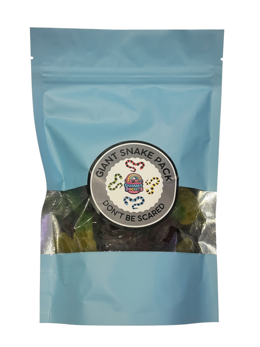 A light blue resealable stand-up pouch with a clear window showing large green and dark-colored giant snake-shaped gummy candies inside. A round dark gray label on the front reads 'GIANT SNAKE PACK' and 'DON'T BE SCARED' with the Gummy Buckets logo surrounded by illustrated colorful snake illustrations in the center.
