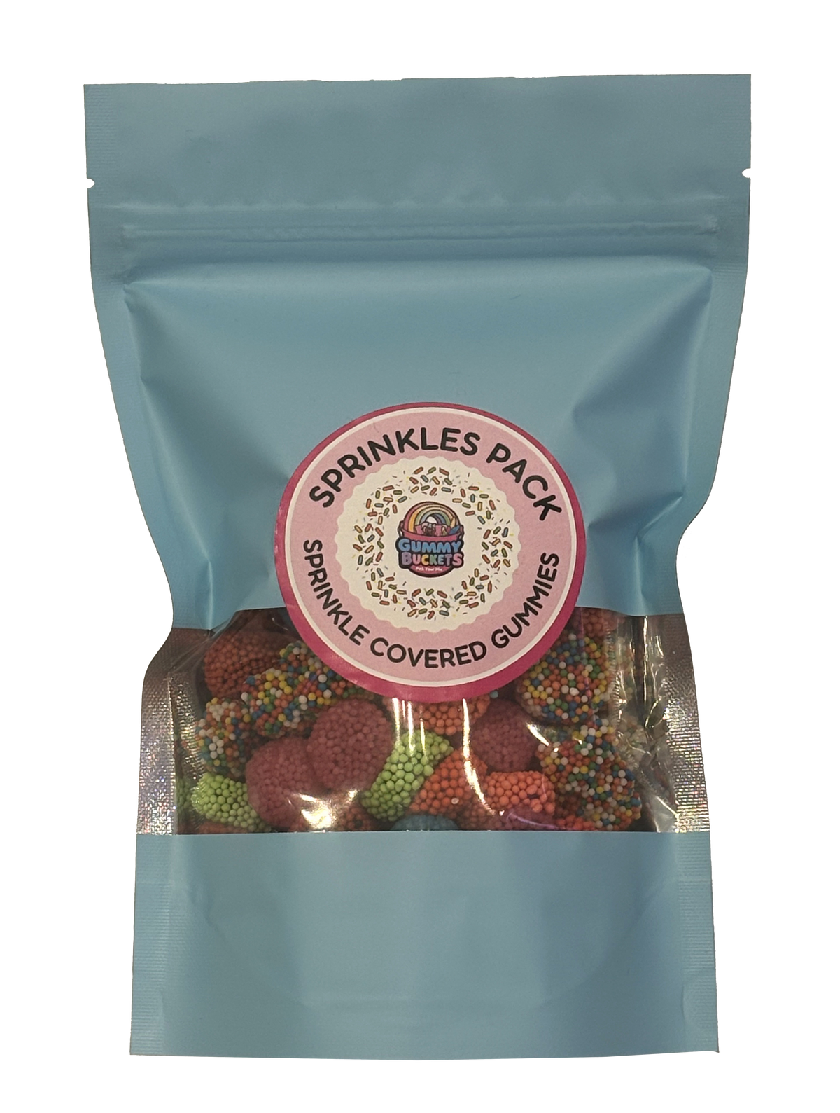 A light blue resealable stand-up pouch with a large clear window showing round gummy candies coated in colorful sprinkles in red, green, orange, and yellow inside. A round pink label on the front reads 'SPRINKLES PACK' and 'SPRINKLE COVERED GUMMIES' with the Gummy Buckets logo surrounded by illustrated sprinkle details in the center.