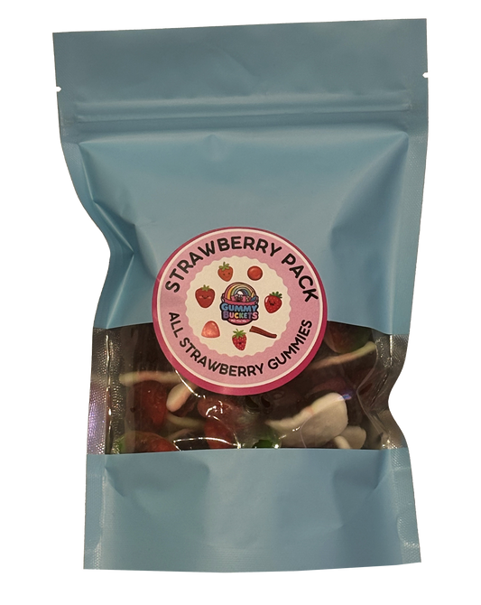 A light blue resealable stand-up pouch with a clear window showing red and white strawberry-shaped and strawberry-flavored gummy candies including strawberry creams and jelly strawberries inside. A round pink label on the front reads 'STRAWBERRY PACK' and 'ALL STRAWBERRY GUMMIES' with the Gummy Buckets logo surrounded by illustrated strawberry icons in the center.
