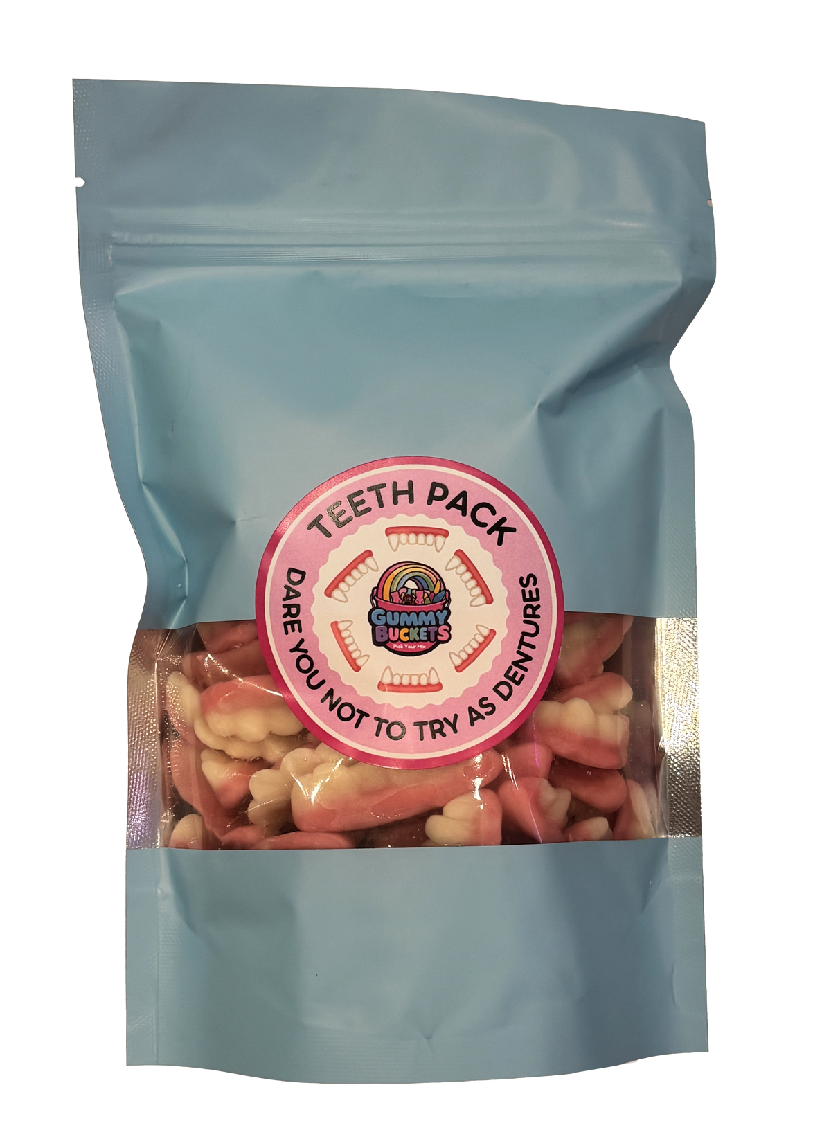 A light blue resealable pouch containing pink and off-white tooth-shaped gummy candies, with a round pink label reading 'TEETH PACK' and 'DARE YOU NOT TO TRY AS DENTURES.'.