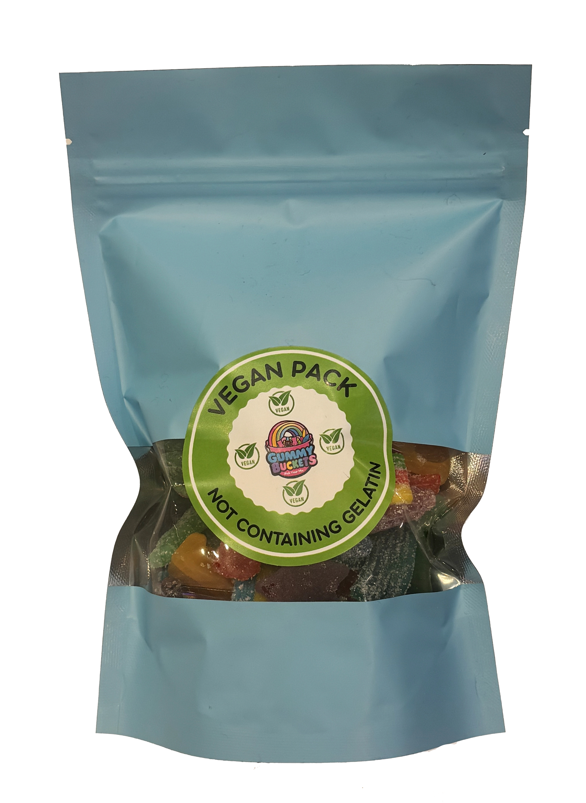 A light blue resealable stand-up pouch with a large clear window showing a dark, rich assortment of vegan gummy candies including bears, cola bottles, and fruit shapes in deep red, black, yellow, and green inside. A round green label on the front reads 'VEGAN PACK' and 'NOT CONTAINING GELATIN' with the Gummy Buckets logo surrounded by four green vegan leaf certification icons in the center.